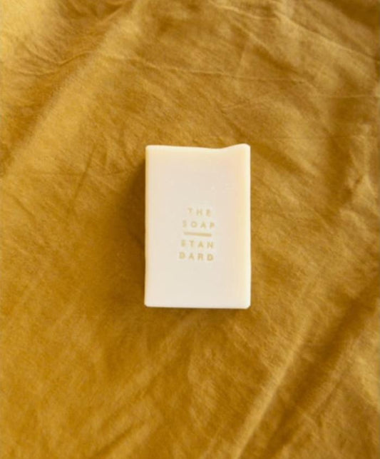 True Bastille Soap Bar on yellow background.