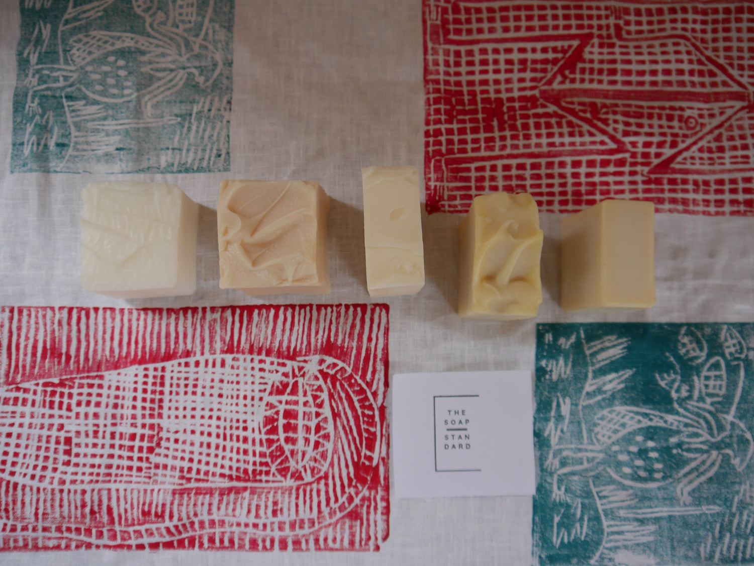 Functional Soap Bars on a Linen cloth with a First Nations lino print design