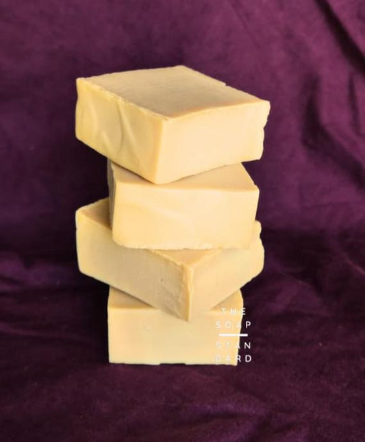 True Castile Soap Bars Stacked on purple background.