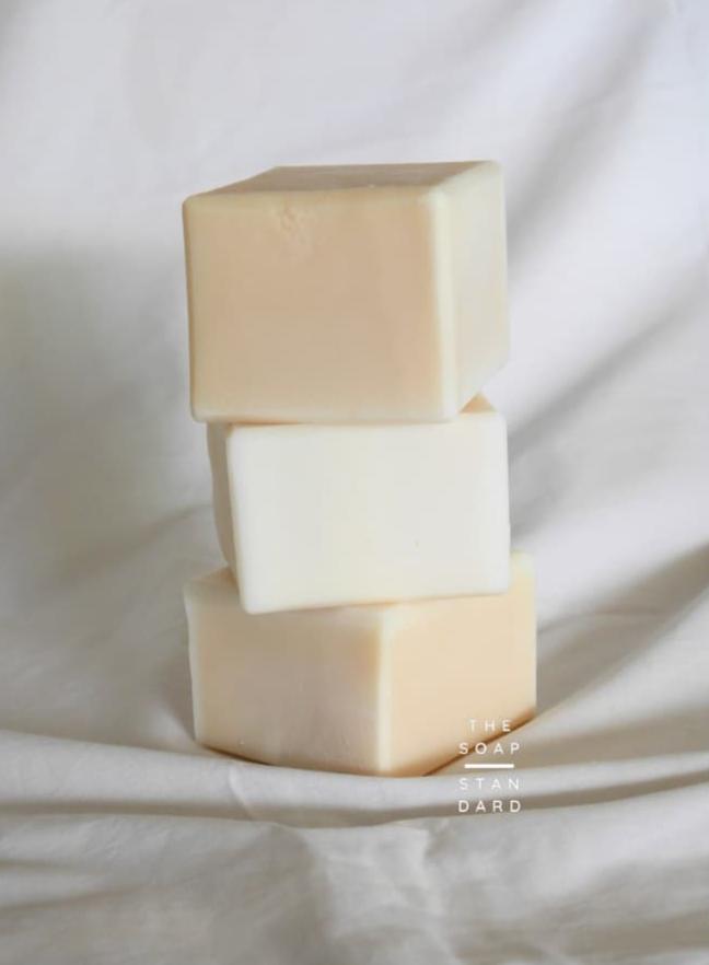 True Dish Soap Blocks stacked on top of each other on white background.