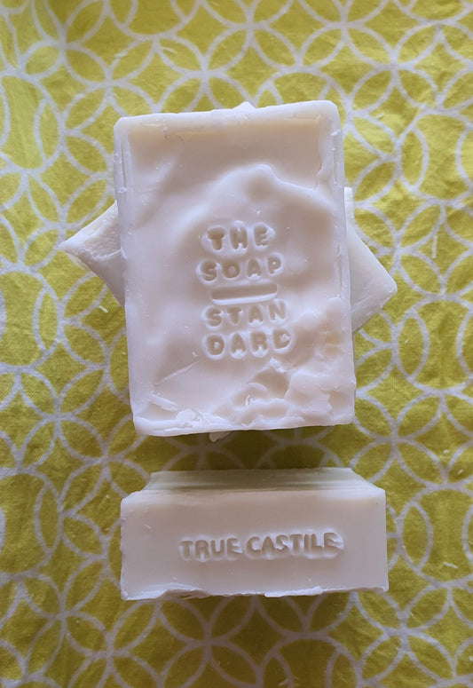 True Castile Soap Bars on yellow and white background.